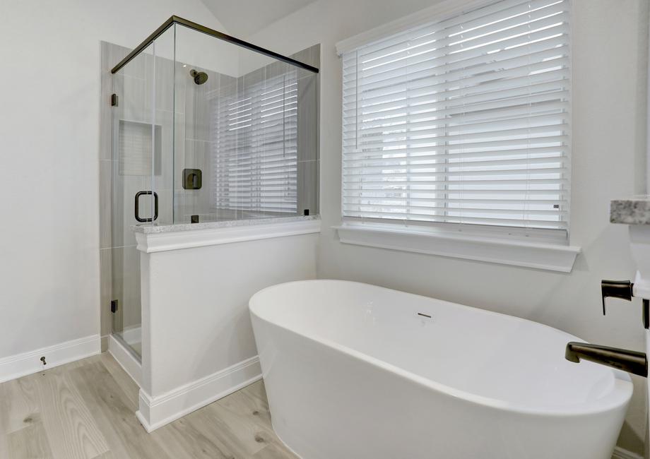 A walk-in shower and soaking tub make the master bathroom feel like a spa.