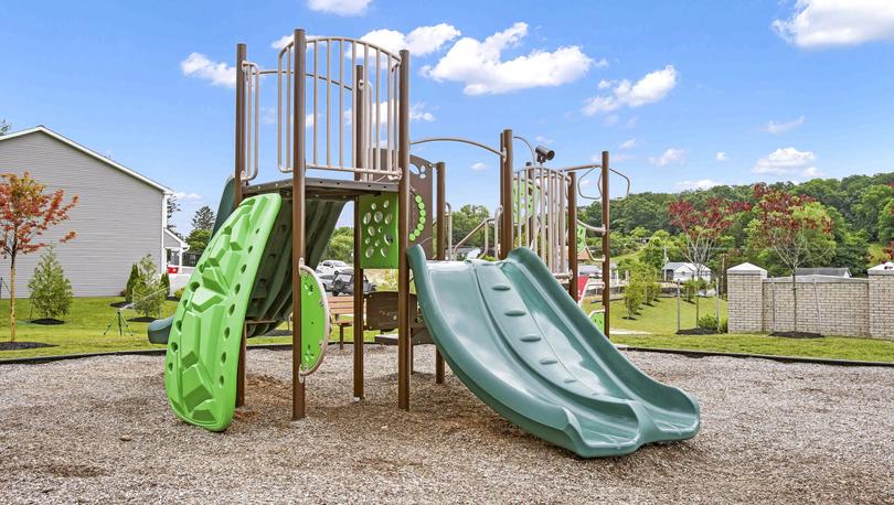 The park features a slide and monkey bars.