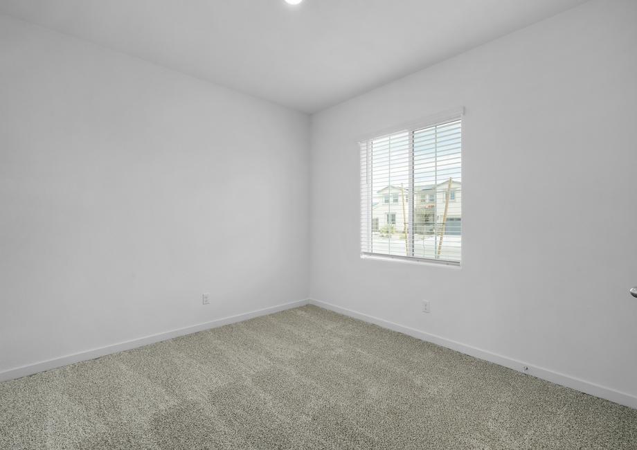 The secondary bedroom has carpet.