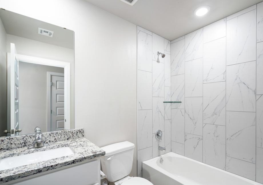 The secondary bathroom has a wonderful shower-tub combo.