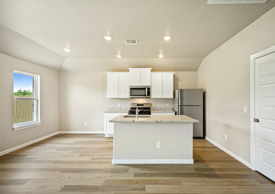 The kitchen seamlessly connects to the breakfast nook.