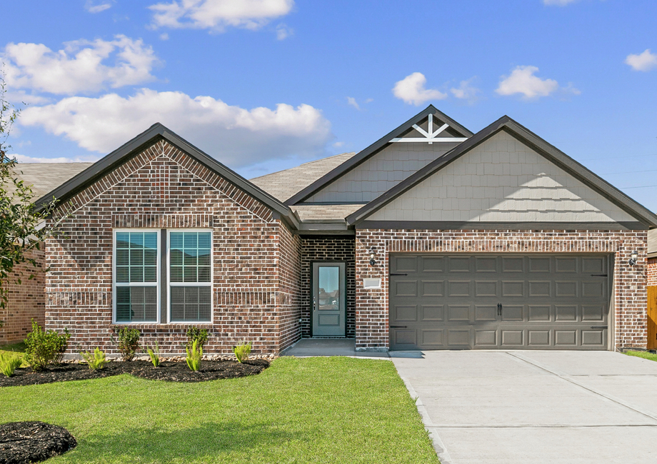 The Ranch plan with dark brick and professional landscaping