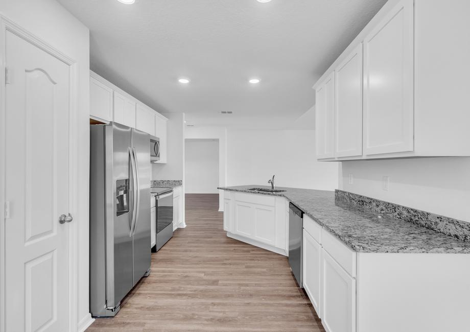 This kitchen is chef-ready with stainless steel appliances and plenty of space to cook