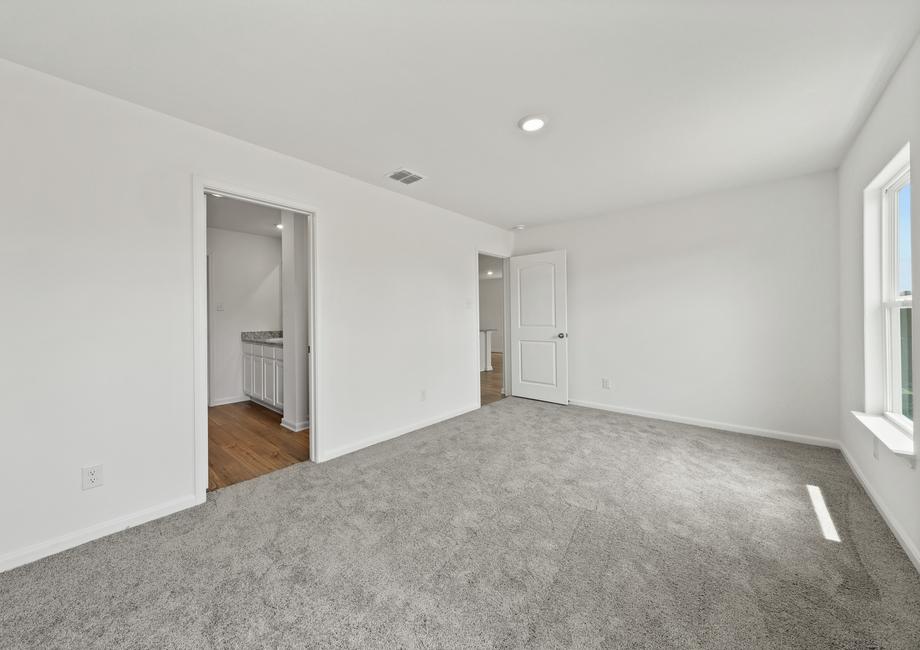 The master bedroom has its own bathroom and walk-in closet