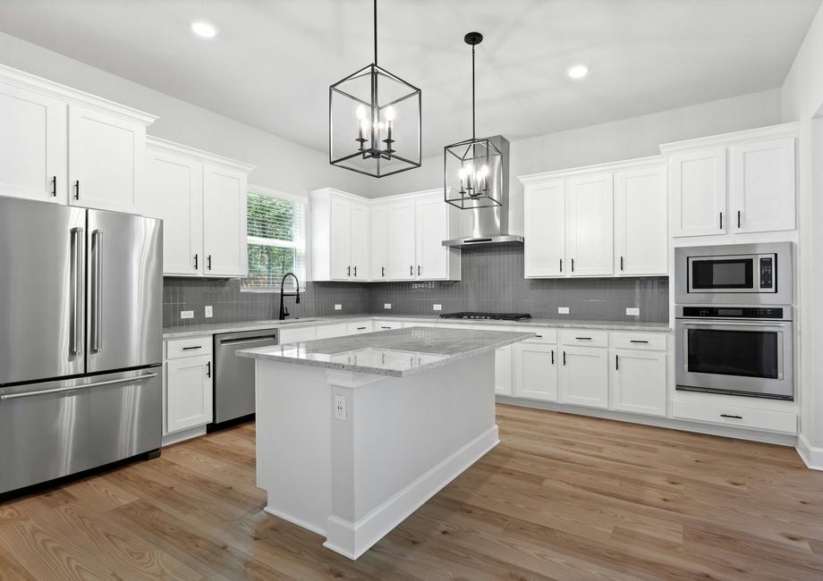 With white cabinets and stainless steel appliances the kitchen is a dream.