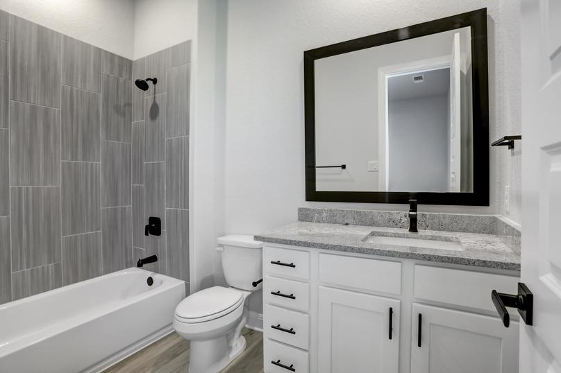 Secondary bathroom with extra drawers and storage space.