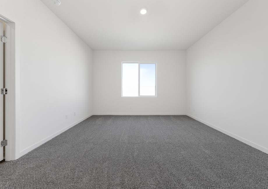 The master bedroom is spacious and airy.