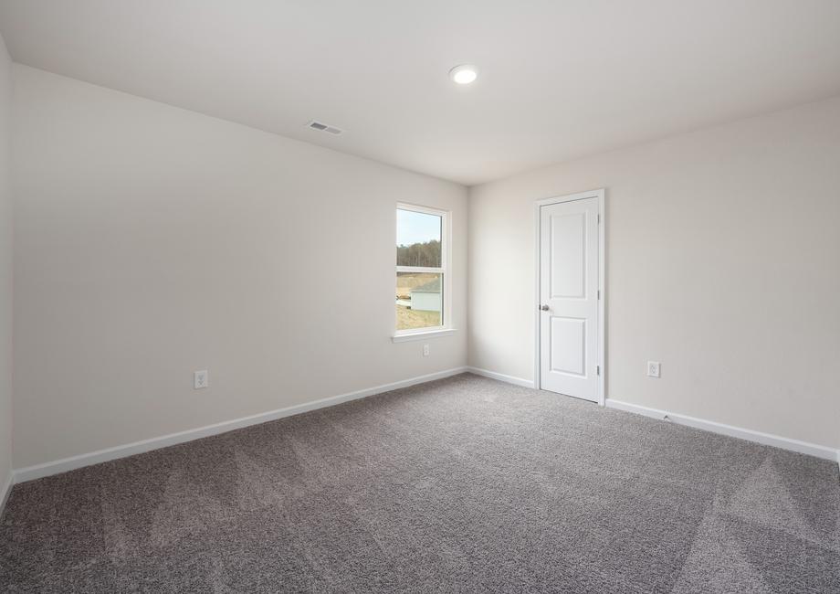 The secondary bedrooms include tan carpets, closets, and bright windows