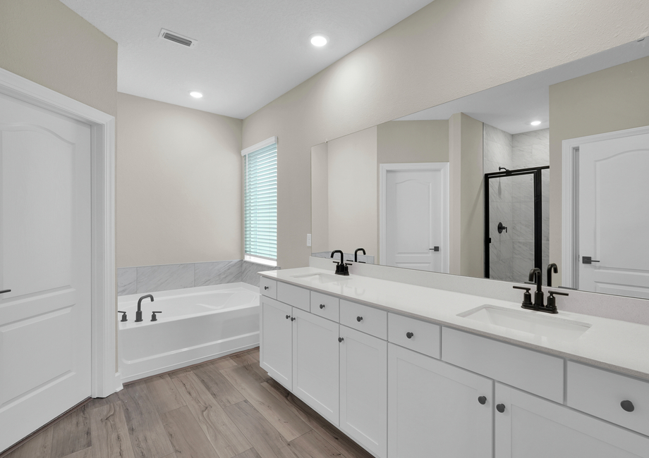 Get ready for your day in this gorgeous master bathroom