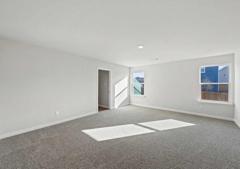 The master bedroom has two large windows that let in great, natural light.