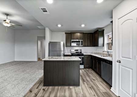 The kitchen is open to the family room in the Blanco plan
