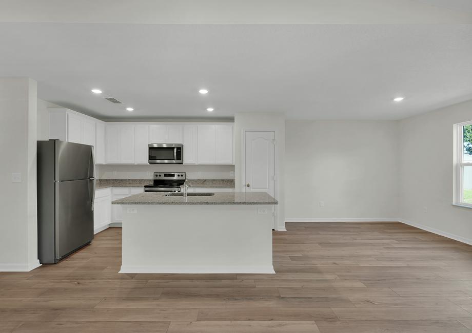 The dining room is open to the kitchen and family room.