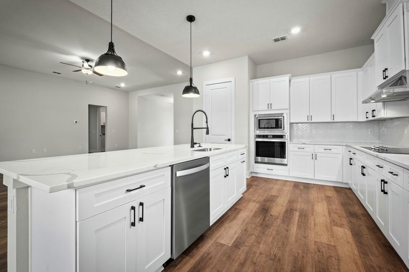Stainless steel appliances are included in the fully loaded kitchen.