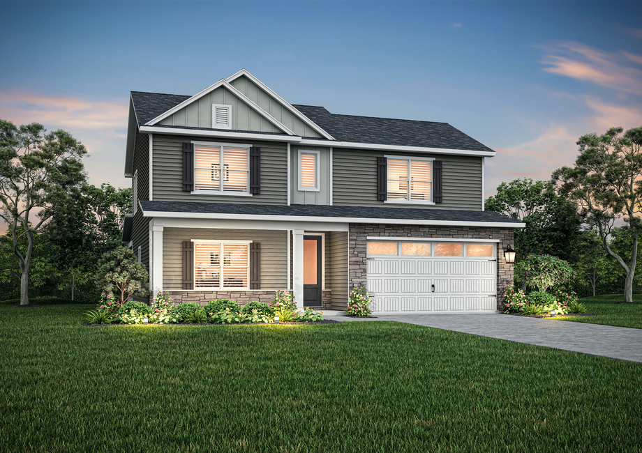 Graham floor plan with siding and stone around the garage at dusk.