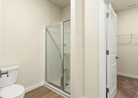 This bathroom has a glass-enclosed shower.