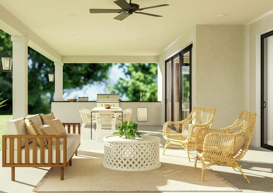 Rendering of the Stratton plan's covered
  patio featuring expansive outdoor kitchen, grill and wet bar. An outdoor
  dining set sits atop a rug under a ceiling fan.