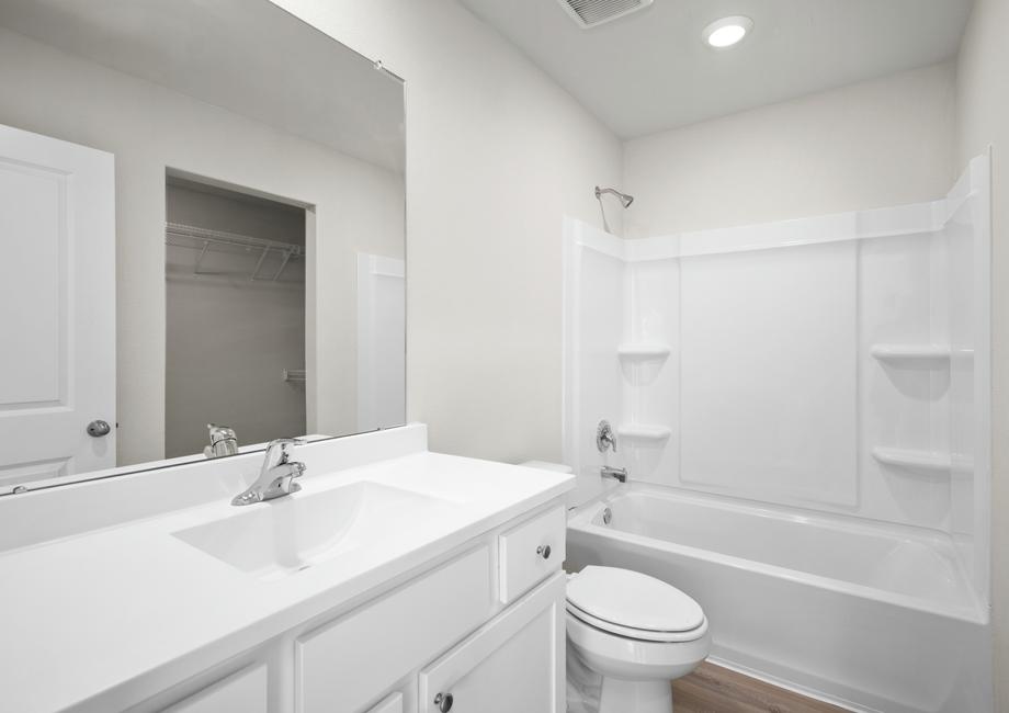 The master bathroom is filled with plenty of storage space.