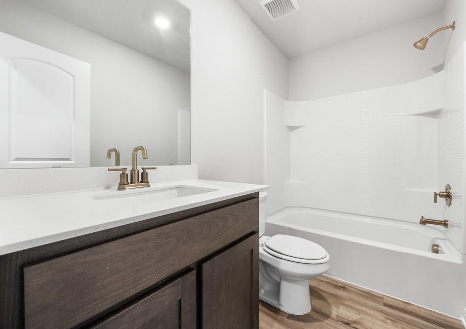 The secondary bathroom of the Rio Grande has a sprawling vanity space and shower-tub combo.