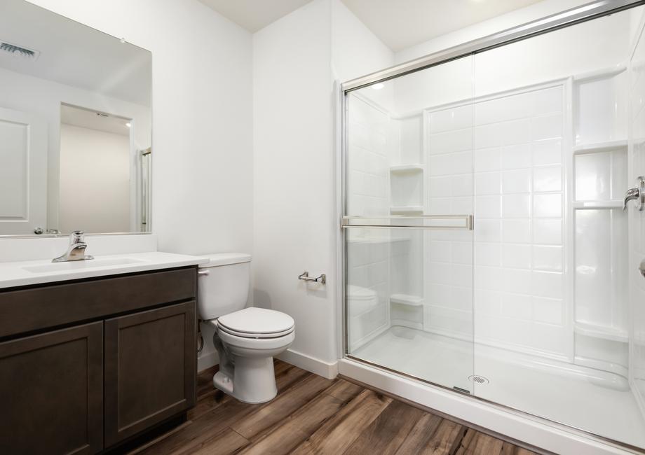 This bathroom has a glass-enclosed shower!