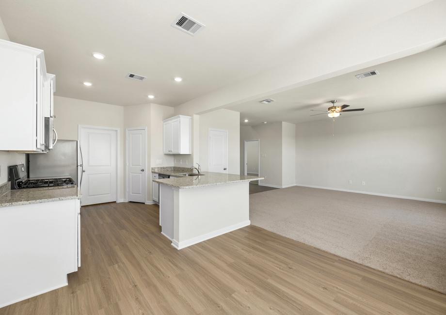 This open concept floor plan has the kitchen open to the family room.