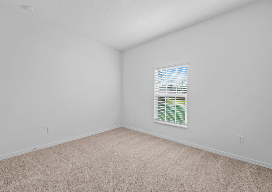 Second bedroom with a view of the front yard