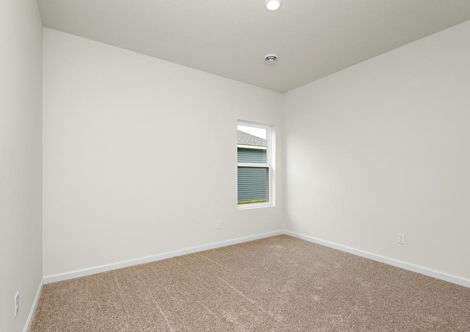 The secondary bedroom has carpet. 