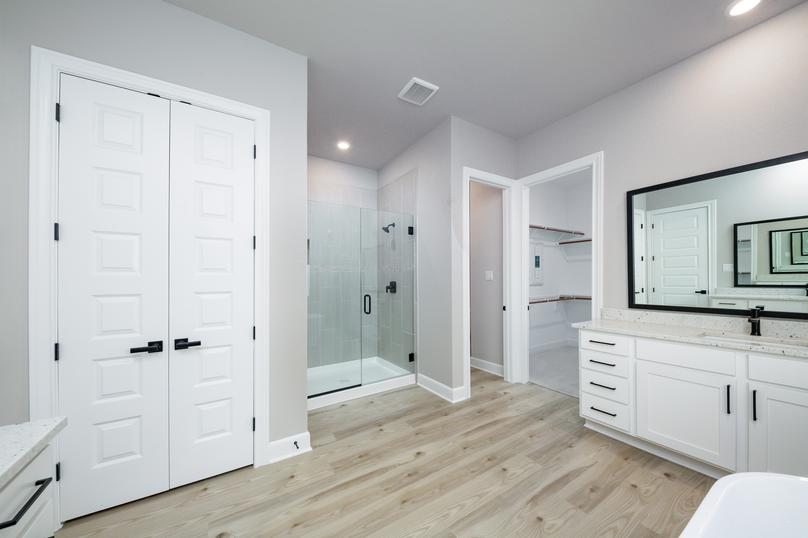 In the master bath you will find a walk-in shower and standalone tub.