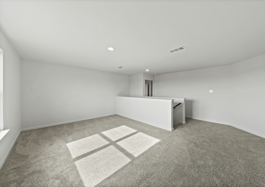 The upstairs loft is a versatile space that was built to fit your family's needs.