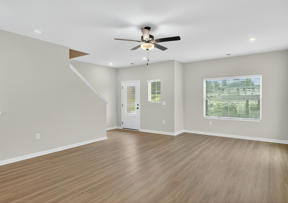 Windows let in lots of light to the living room. 