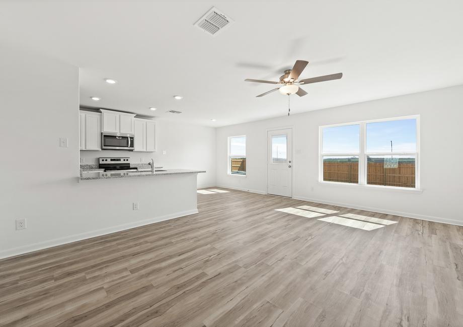 The family room and adjoining dining room get tons of natural light