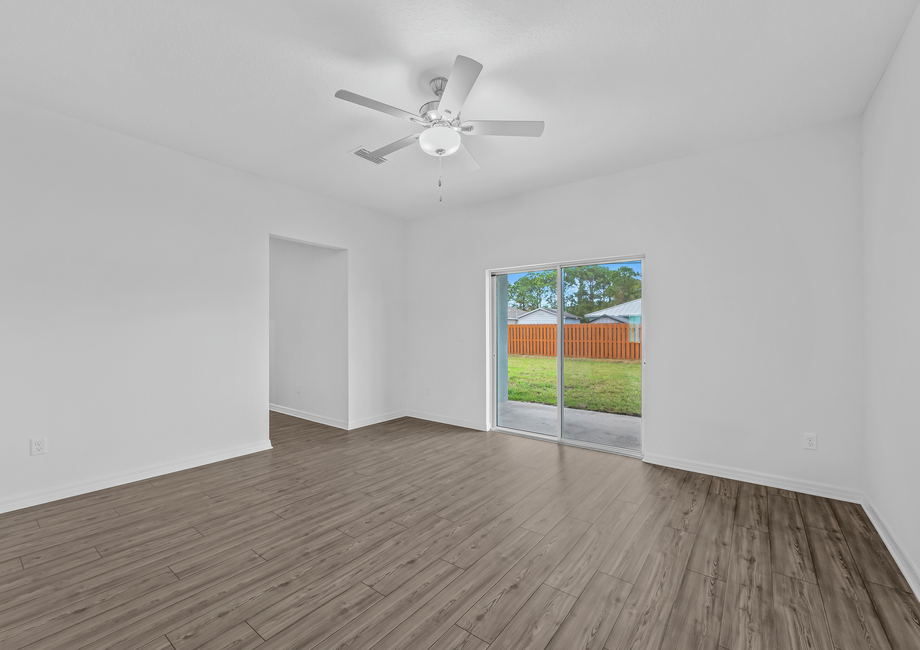 Sliding door in the family room leads to the covered back patio