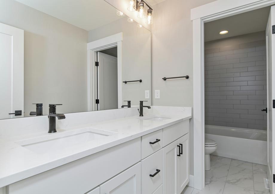 Secondary bathrooms have tons of storage space.
