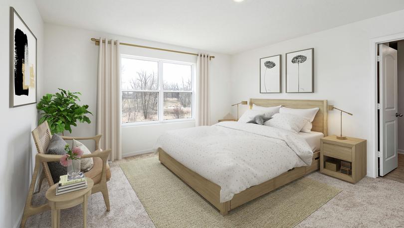 Photo of a bedroom with a queen size bed with end tables, a double window with drapes, a sitting area with chairs and a plant.