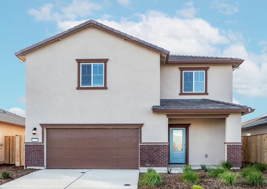 The Palomino is a beautiful home with stucco and brick.