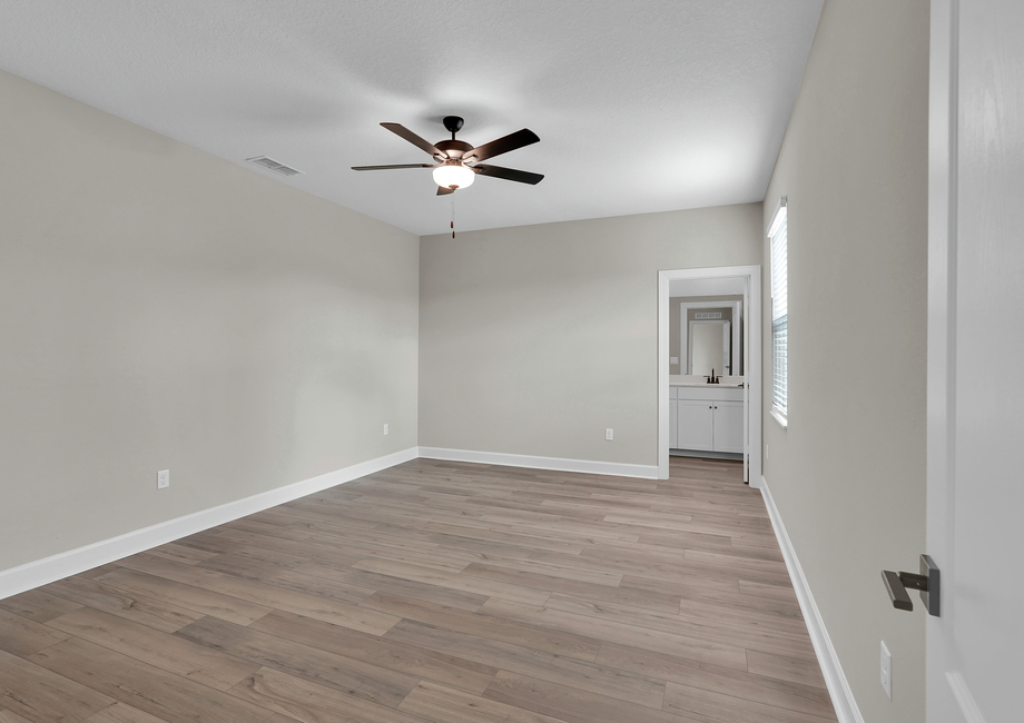 Rest and relaxation await in this gorgeous master bedroom