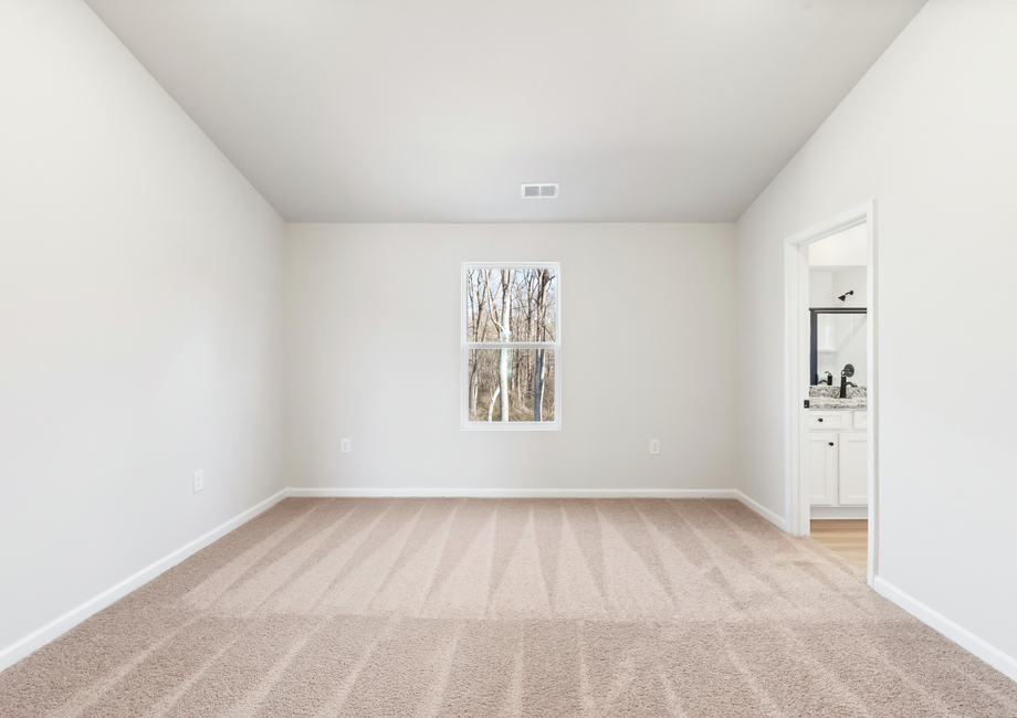 The master bedroom has lots of windows to let in natural light