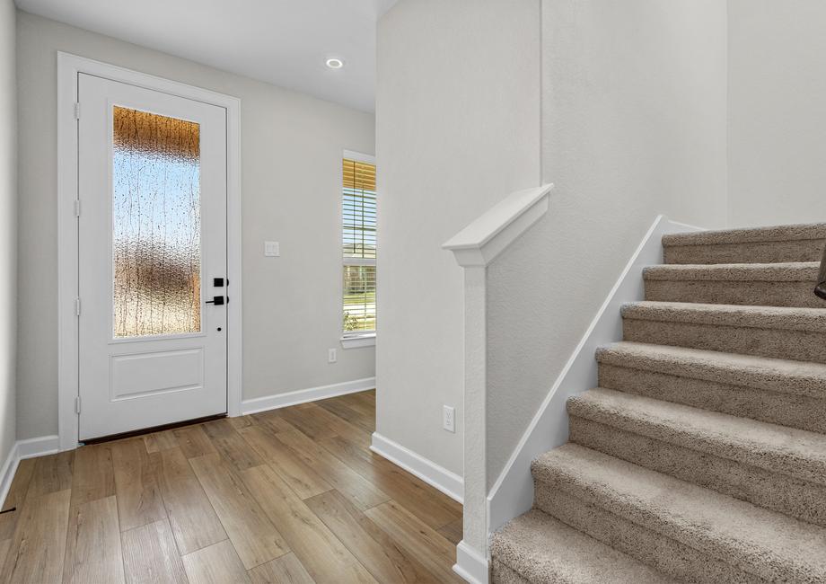 The entryway is highlighted by this gorgeous 3/4 lite door!