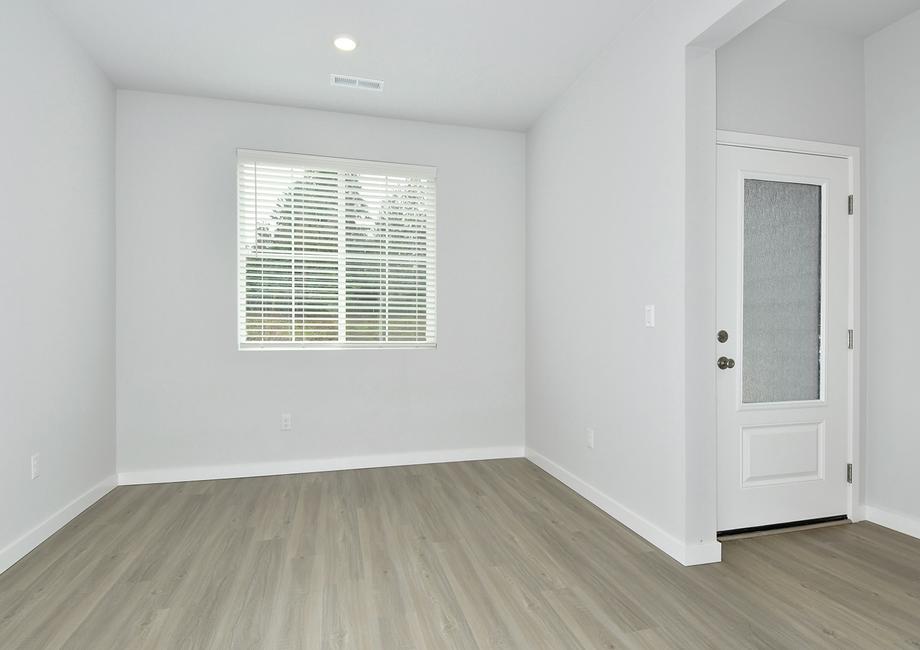 The formal dining room is off of the foyer.