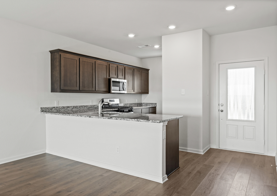 The kitchen has sprawling granite countertops.