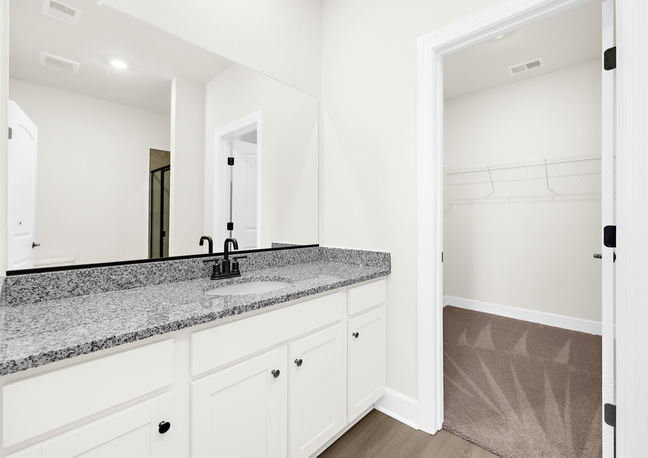 This bathroom has granite countertops