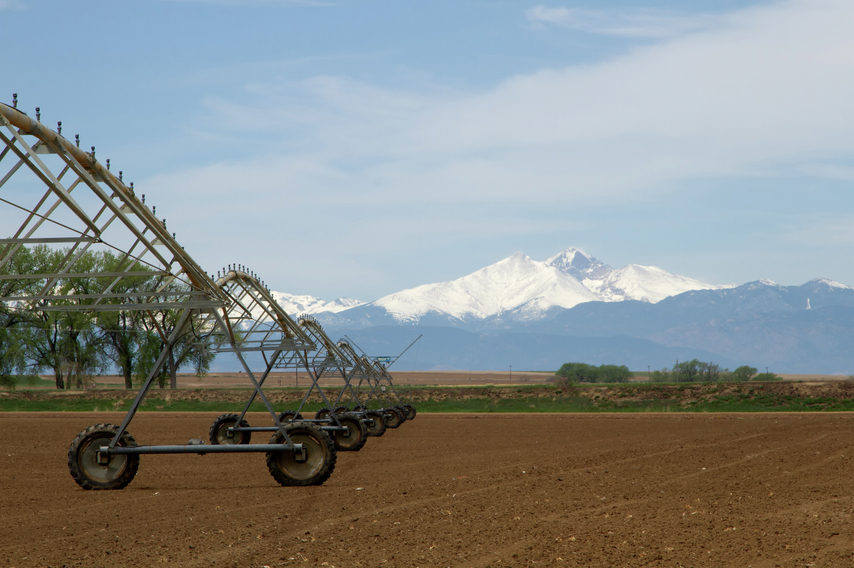 Pivot Irrigation System in an agriculture field with Longs Peak in the background stock photo