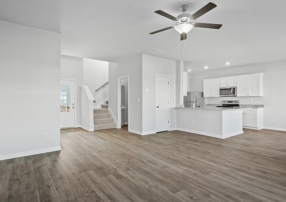 The spacious family room is connected to the kitchen and entry way.