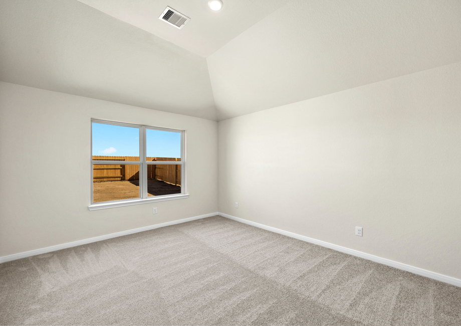 The master bedroom has a large window that lets in great, natural light.