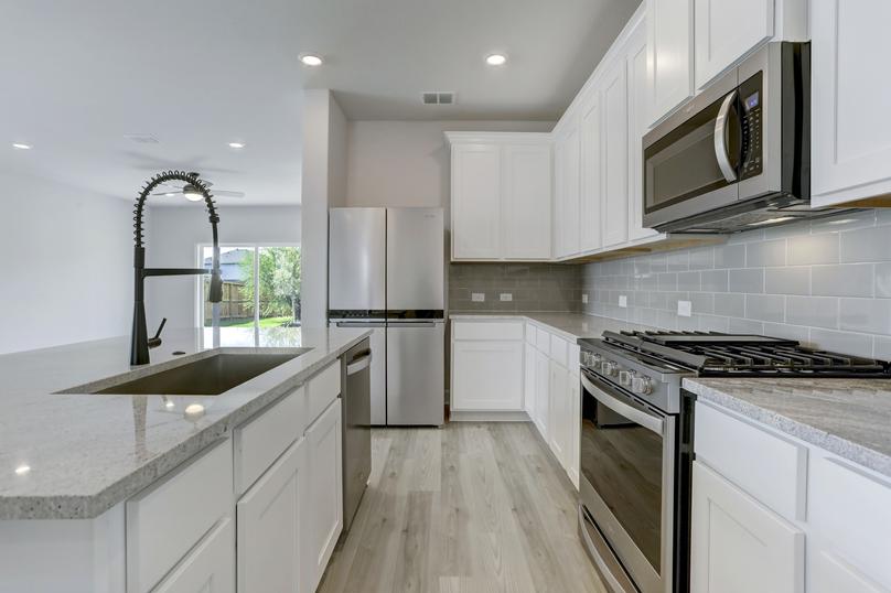 Upgraded kitchen with stainless appliances.