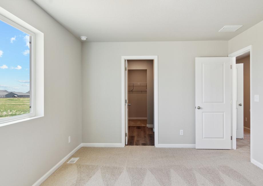 The master suite includes a bedroom, bathroom and walk-in closet.