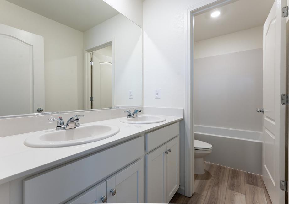 The secondary bathroom has a tub/shower combo.