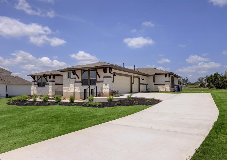 Angled exterior of the Hampton plan with a side-load three-car garage.