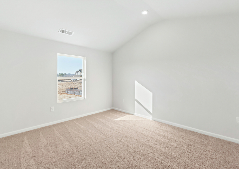 The master bedroom has lots of windows to let in natural light