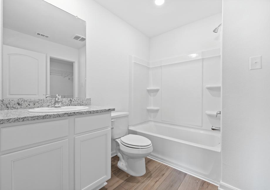 The master bathroom has a tub/shower combination.