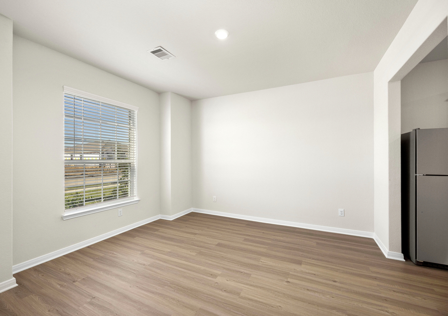 The dining room has a large window that lets in great, natural light.